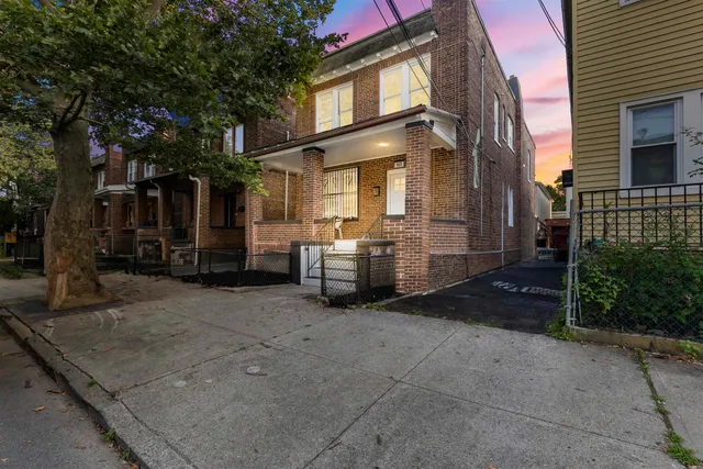 a view of a car park in front of house