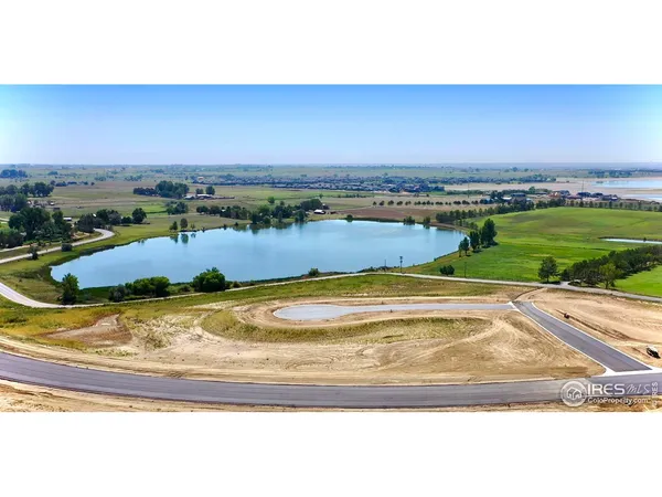 a view of a swimming pool with a yard