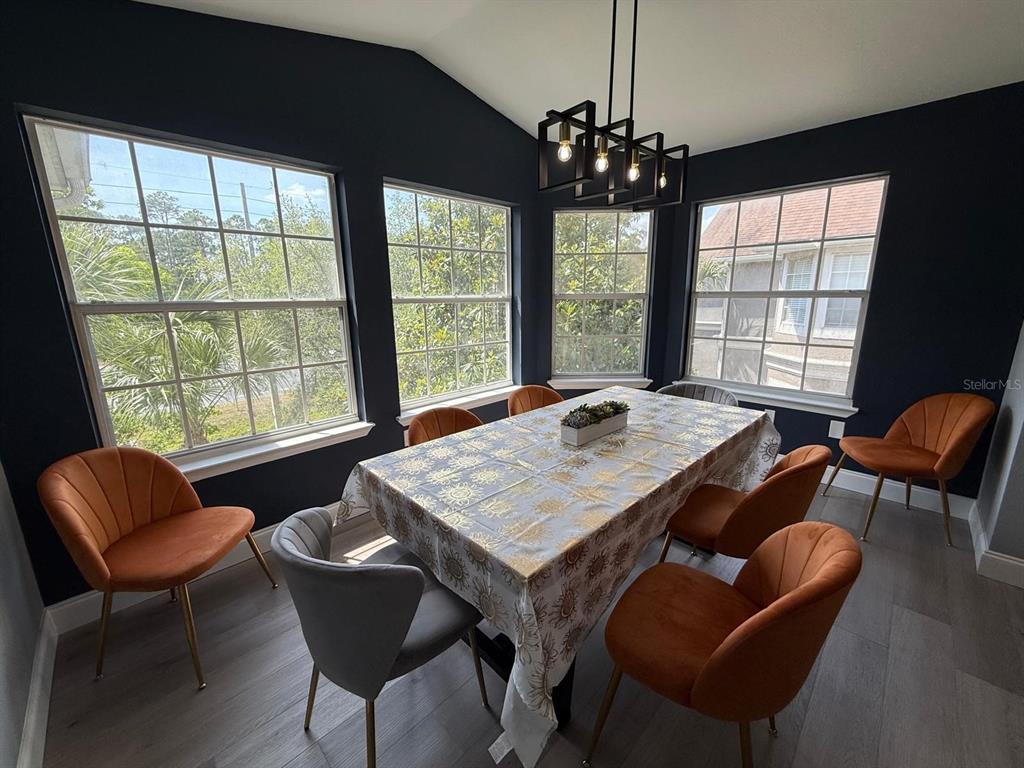 3391 South Kirkman Road, Unit 1236 Orlando, FL 32811 - Photo 15 of 30 a view of a dining room with furniture window and outside view