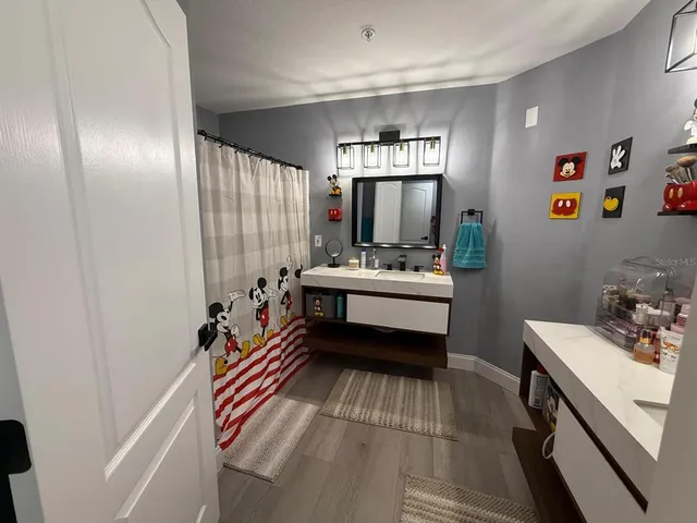 a bedroom with a bed and a furniture