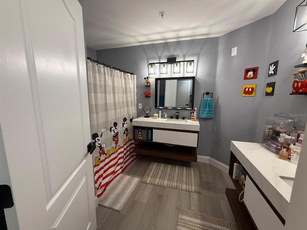 3391 South Kirkman Road, Unit 1236 Orlando, FL 32811 - Photo 21 of 30 a bedroom with a bed and a furniture