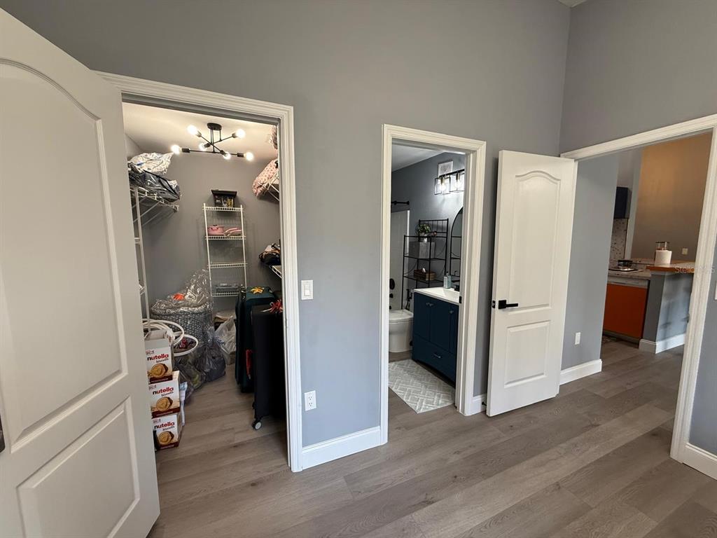3391 South Kirkman Road, Unit 1236 Orlando, FL 32811 - Photo 25 of 30 a view of a hallway view with wooden floor and dining room view