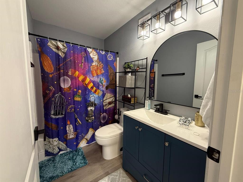 3391 South Kirkman Road, Unit 1236 Orlando, FL 32811 - Photo 28 of 30 a bathroom with a sink toilet and shower