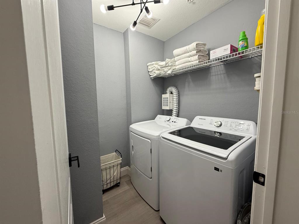 3391 South Kirkman Road, Unit 1236 Orlando, FL 32811 - Photo 30 of 30 a utility room with dryer and washer