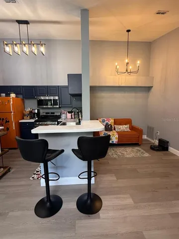 a kitchen with stainless steel appliances a sink cabinets and stove