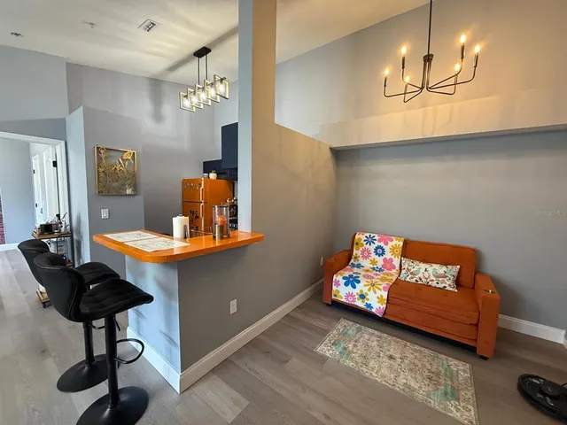 a bedroom with furniture and a wooden floor