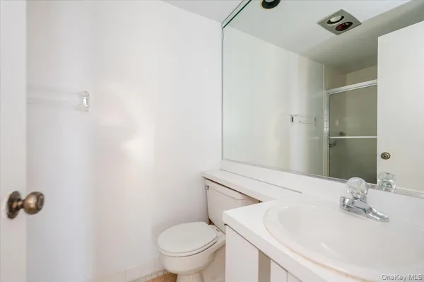 a bathroom with a sink and toilet