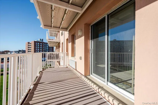 a view of a balcony with wooden floor