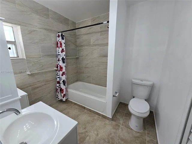 an empty room with a empty space and windows