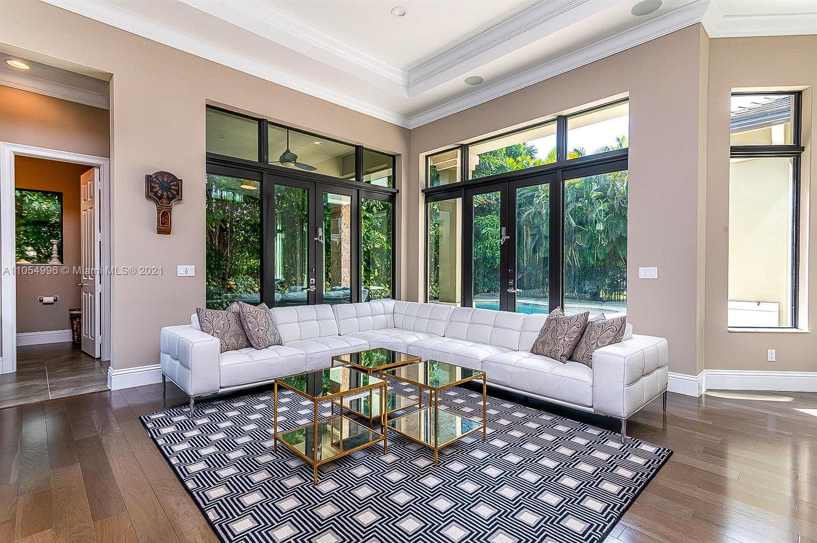 17766 Cadena Drive Boca Raton, FL 33496 - Photo 11 of 28 a living room with furniture and a large window