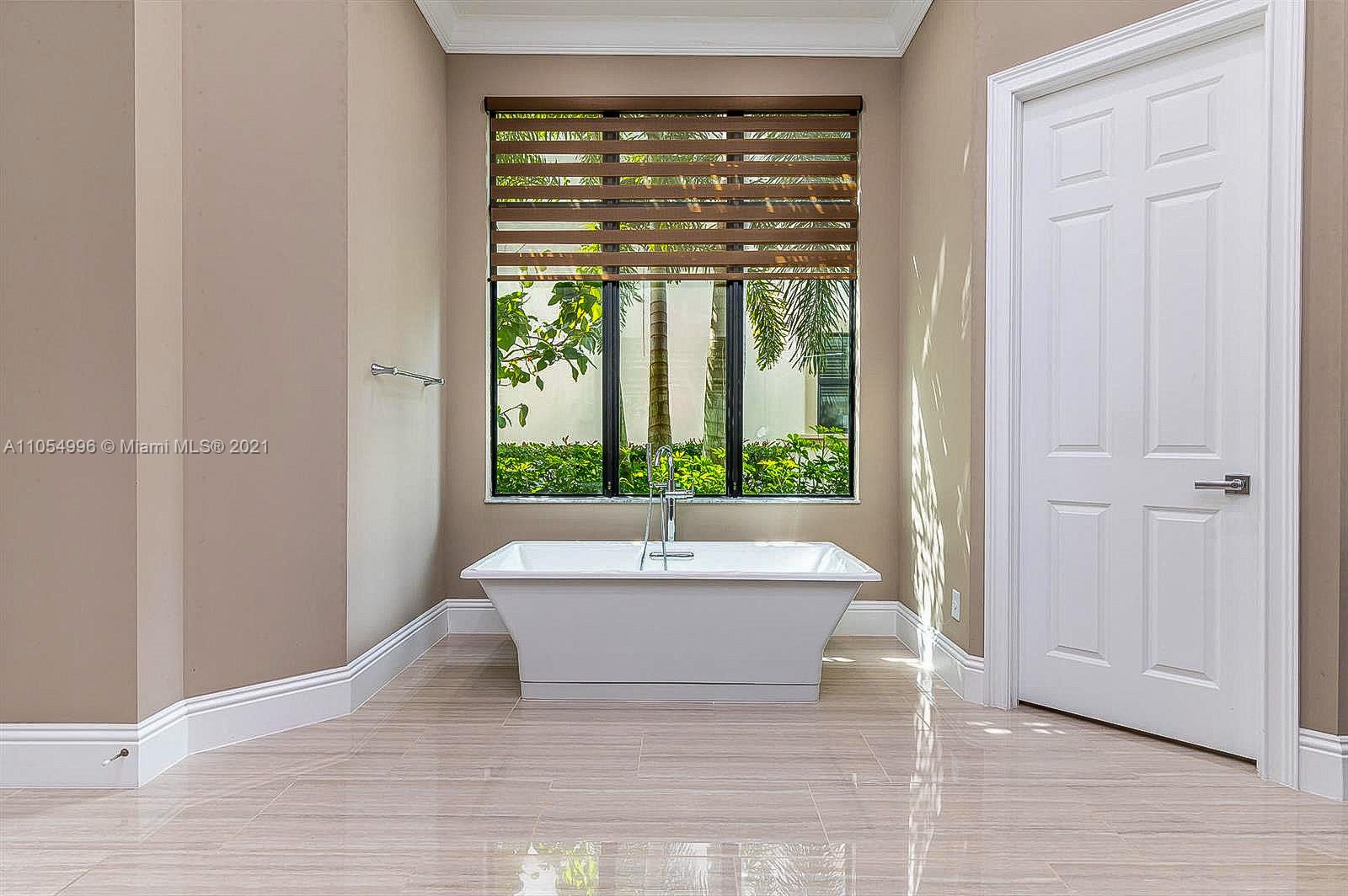 17766 Cadena Drive Boca Raton, FL 33496 - Photo 17 of 28 a bathroom with a sink and bathtub