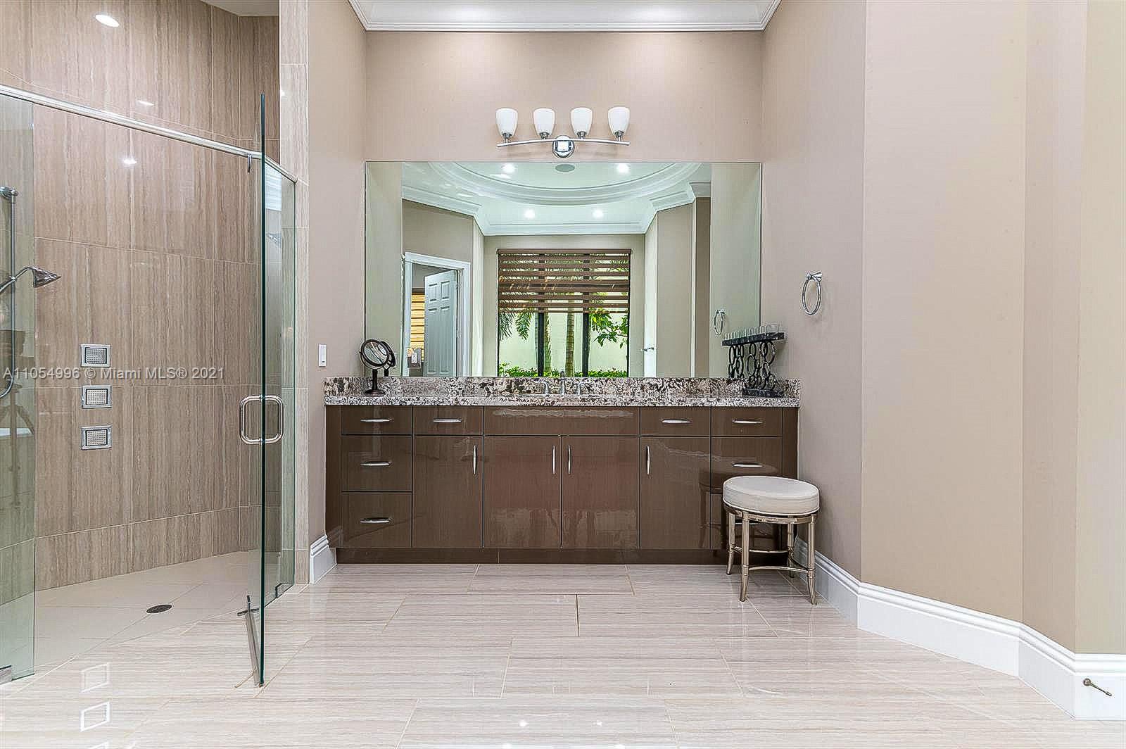 17766 Cadena Drive Boca Raton, FL 33496 - Photo 18 of 28 a bathroom with a sink and a mirror