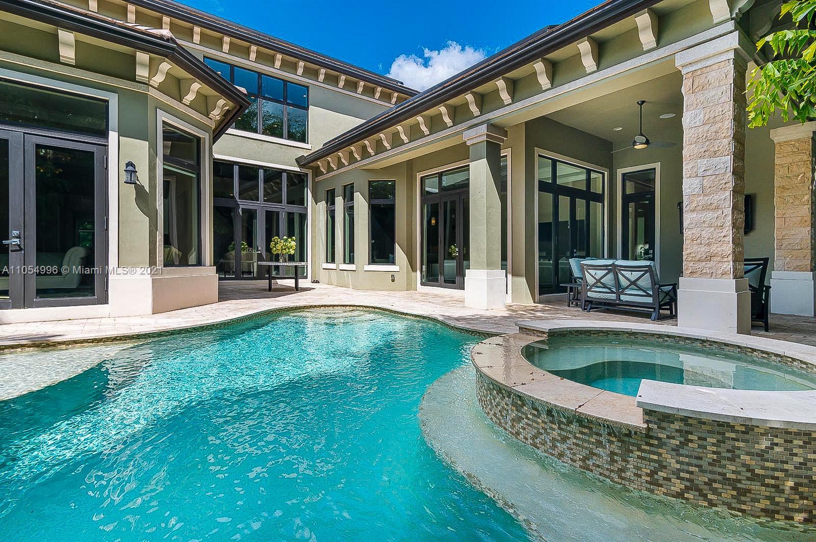 17766 Cadena Drive Boca Raton, FL 33496 - Photo 26 of 28 front view of a house with swimming pool and porch