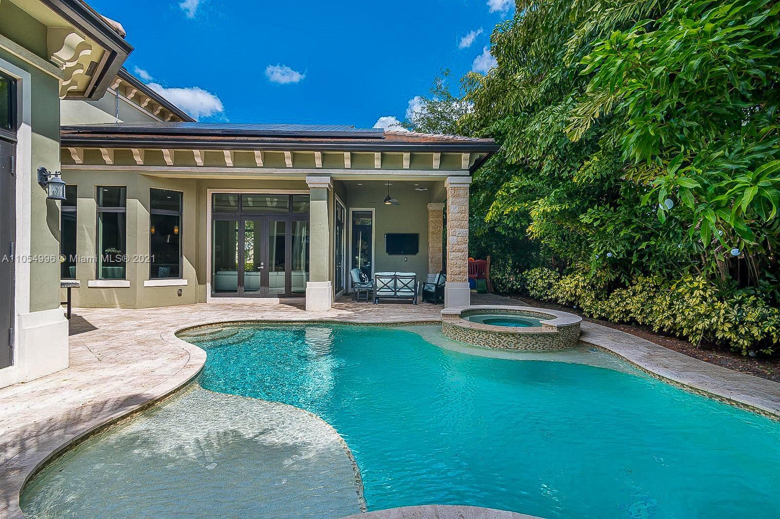 17766 Cadena Drive Boca Raton, FL 33496 - Photo 27 of 28 front view of a house with swimming pool and porch with furniture