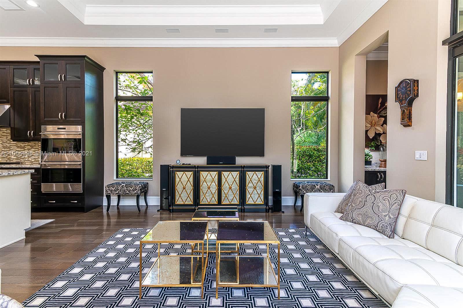 17766 Cadena Drive Boca Raton, FL 33496 - Photo 8 of 28 a living room with furniture and a flat screen tv