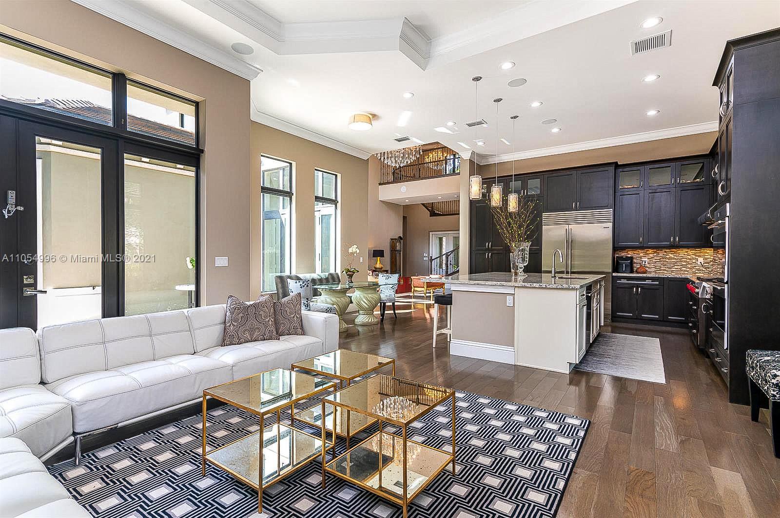 17766 Cadena Drive Boca Raton, FL 33496 - Photo 9 of 28 a living room with furniture and a large window