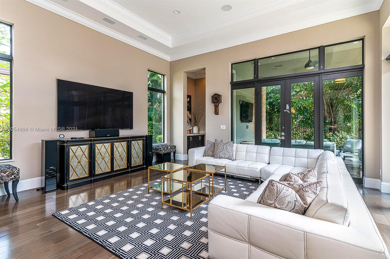 17766 Cadena Drive Boca Raton, FL 33496 - Photo 10 of 28 a living room with furniture and a flat screen tv