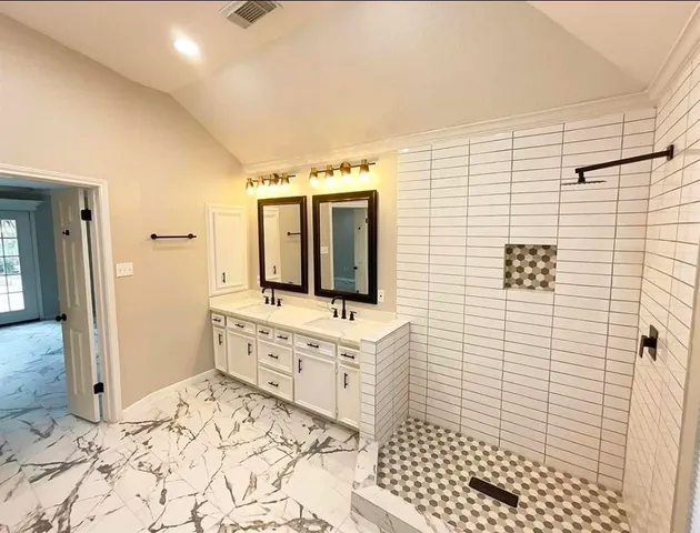 an empty room with a window and a ceiling fan