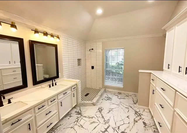 an empty room with a window and a ceiling fan