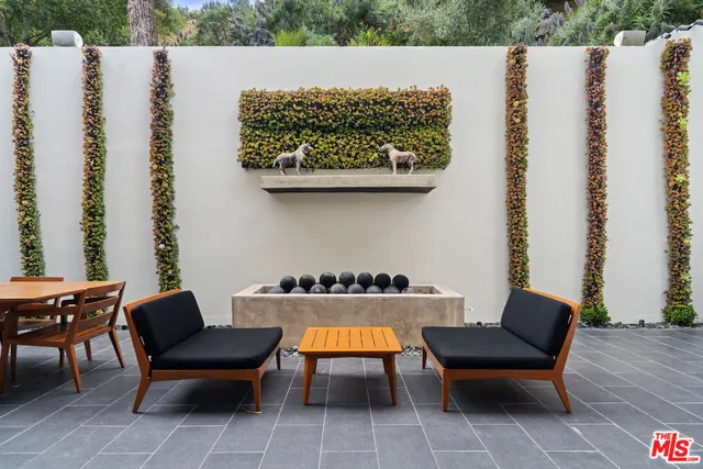 a view of a swimming pool with an outdoor space and seating area
