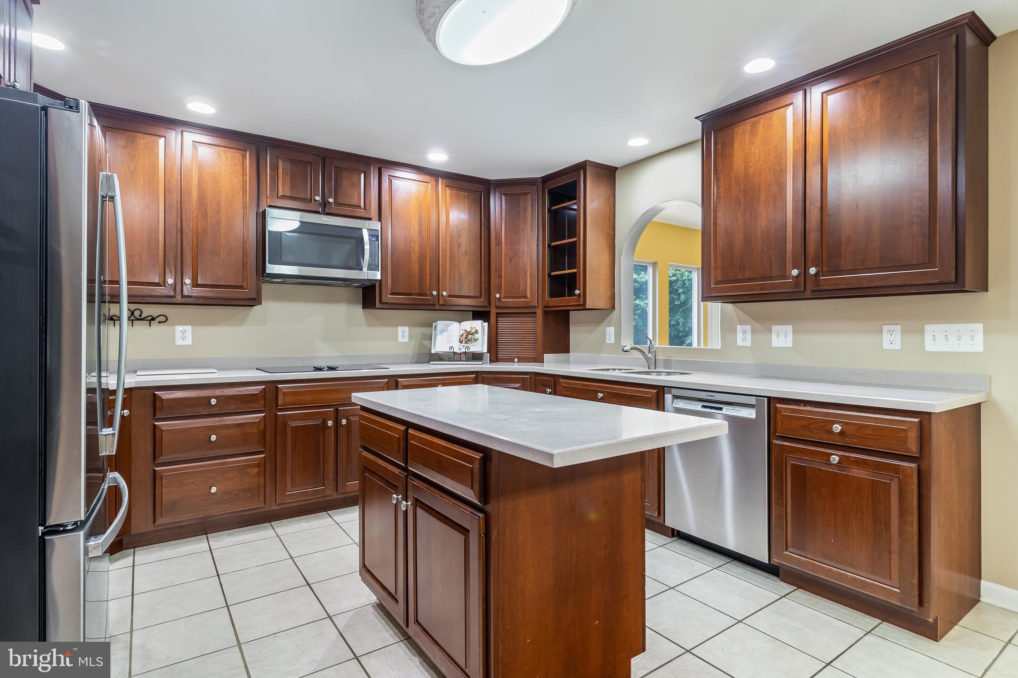 203 Morgans Ridge Court La Plata, MD 20646 - Photo 15 of 59 a kitchen with a sink stove and cabinets