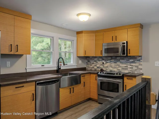 a bedroom with a bed and a mirror