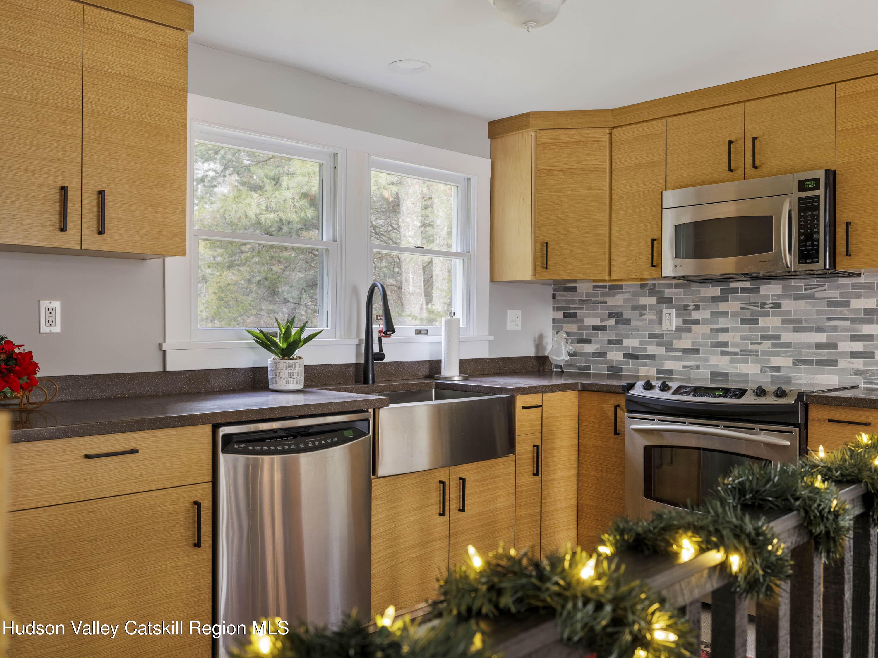 61 Hemlock Road Jewett, NY 12444 - Photo 16 of 45 a kitchen with stainless steel appliances granite countertop a sink a stove and a microwave