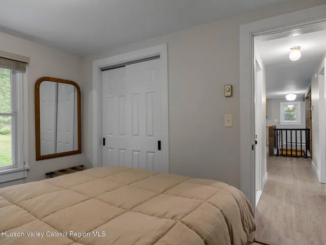 a view of a livingroom with furniture and a flat screen tv