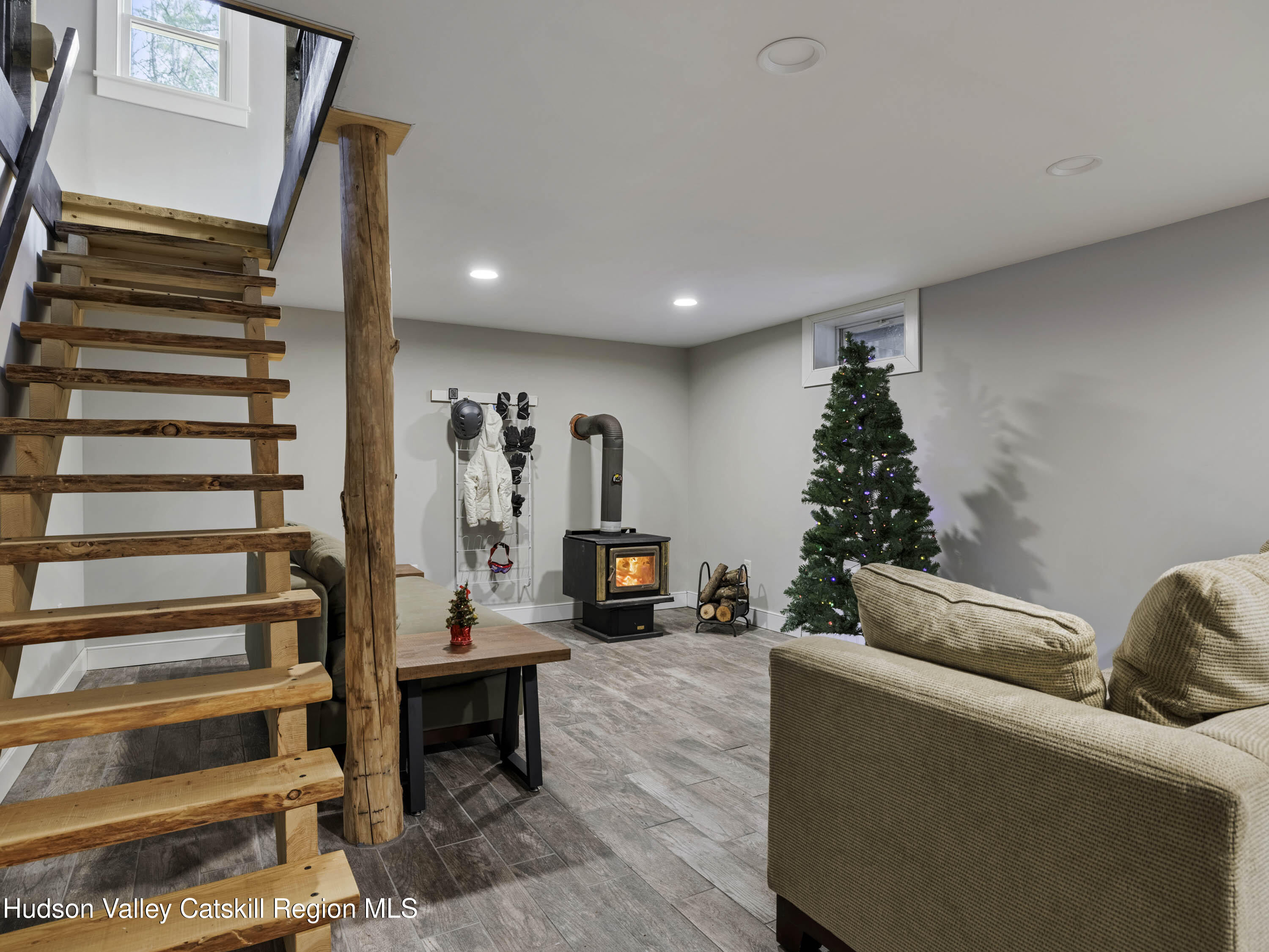 61 Hemlock Road Jewett, NY 12444 - Photo 20 of 45 a living room with furniture and a fireplace