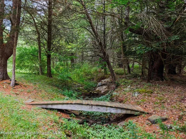 a view of a wooden deck with a yard
