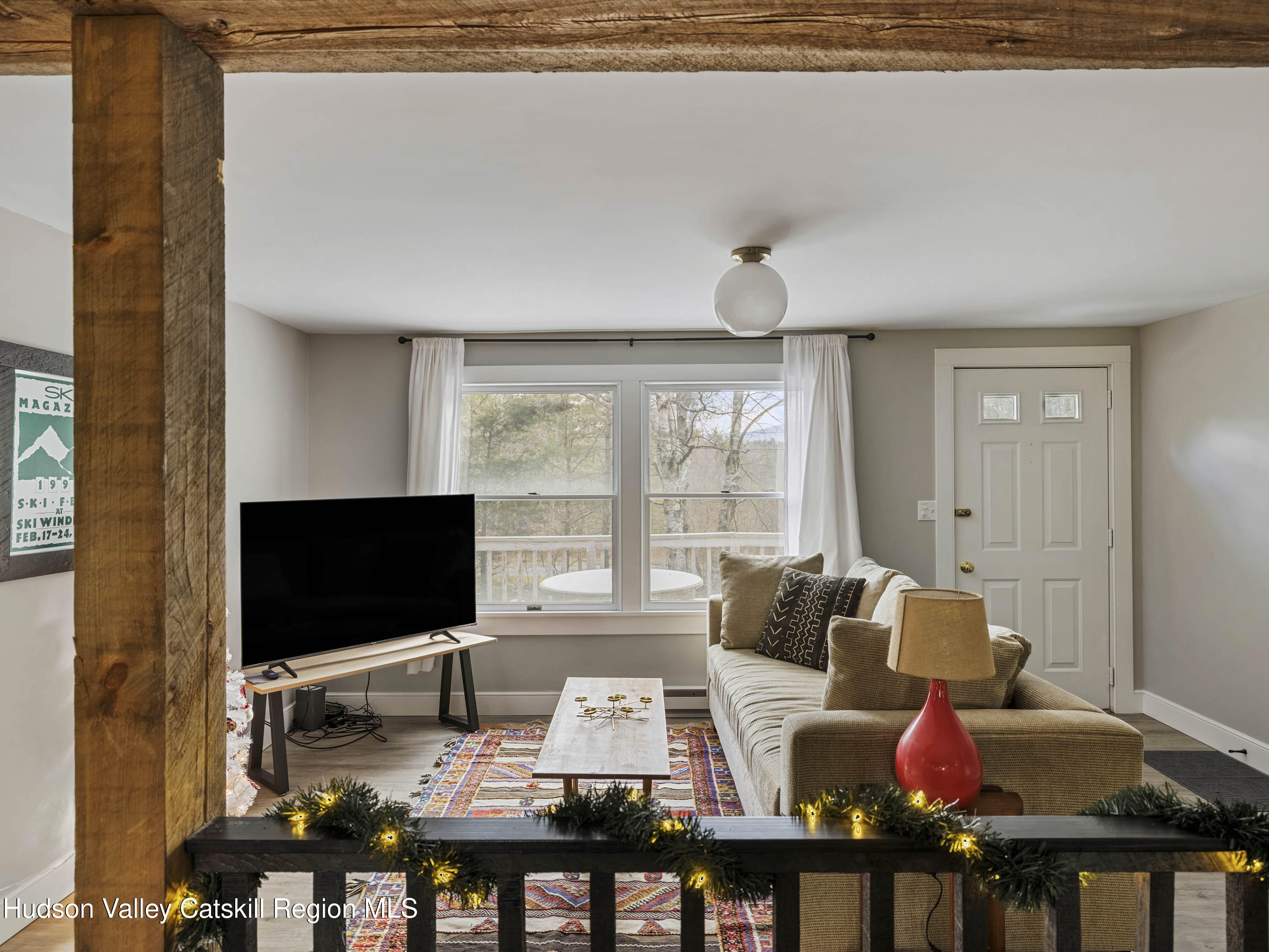 61 Hemlock Road Jewett, NY 12444 - Photo 10 of 45 a living room with furniture and a flat screen tv