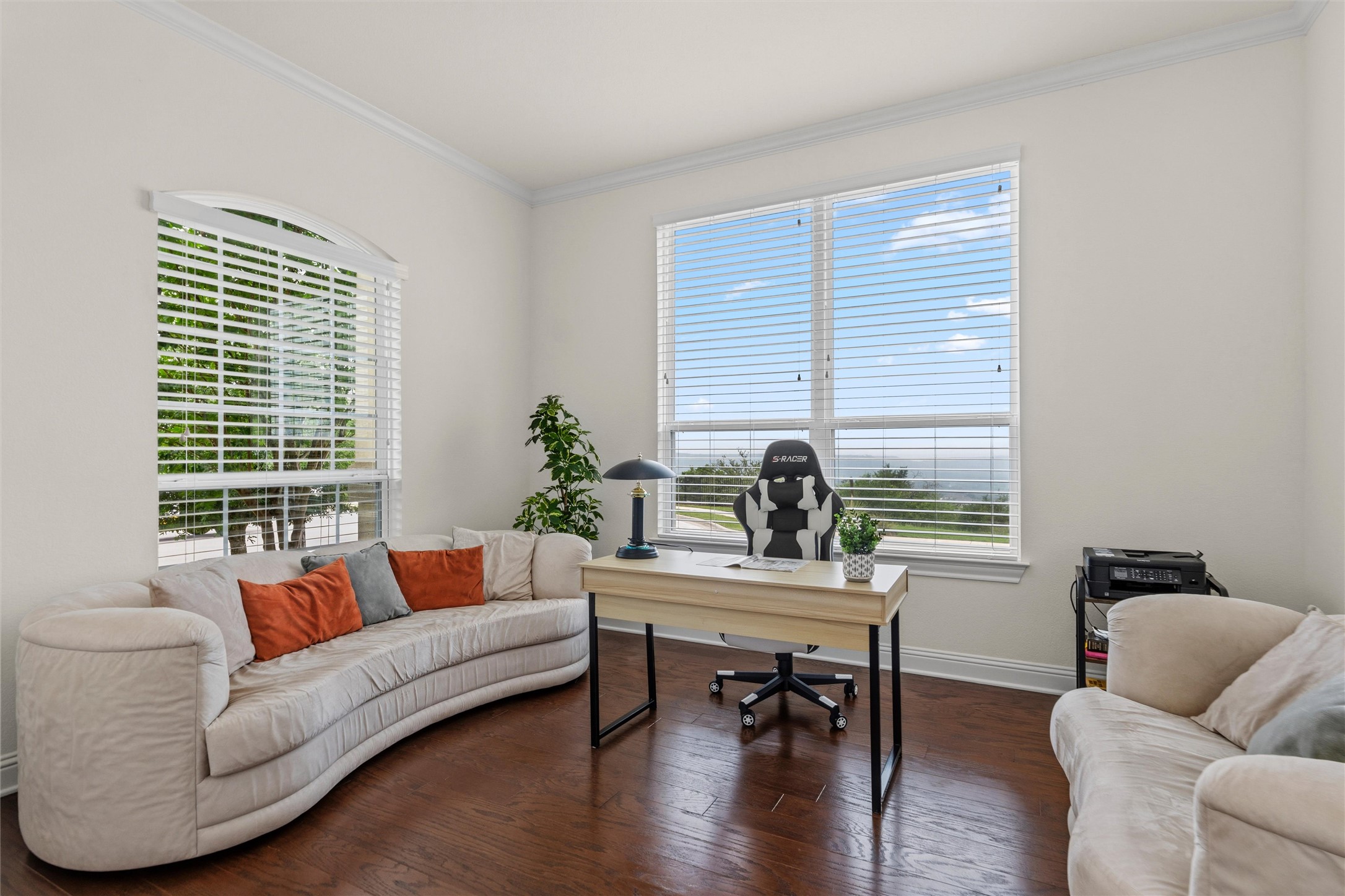 1733 Siena Sunset Road Leander, TX 78641 - Photo 14 of 40 Spacious room featuring rich wood-finish flooring and ample natural light from multiple windows with great hill country and sunset views