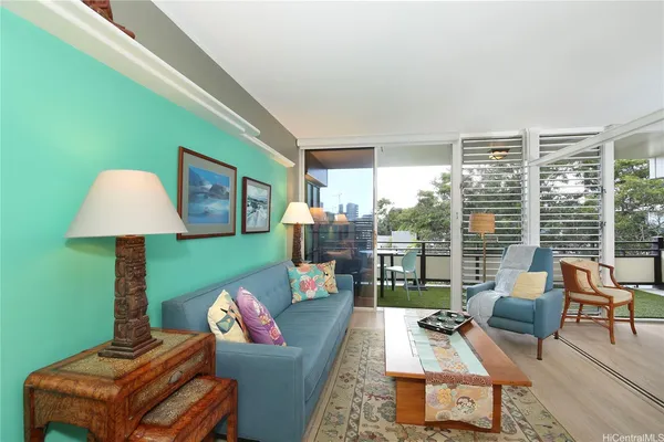 a living room with furniture and a large window