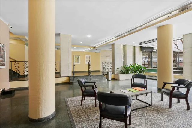a living room with furniture and a table