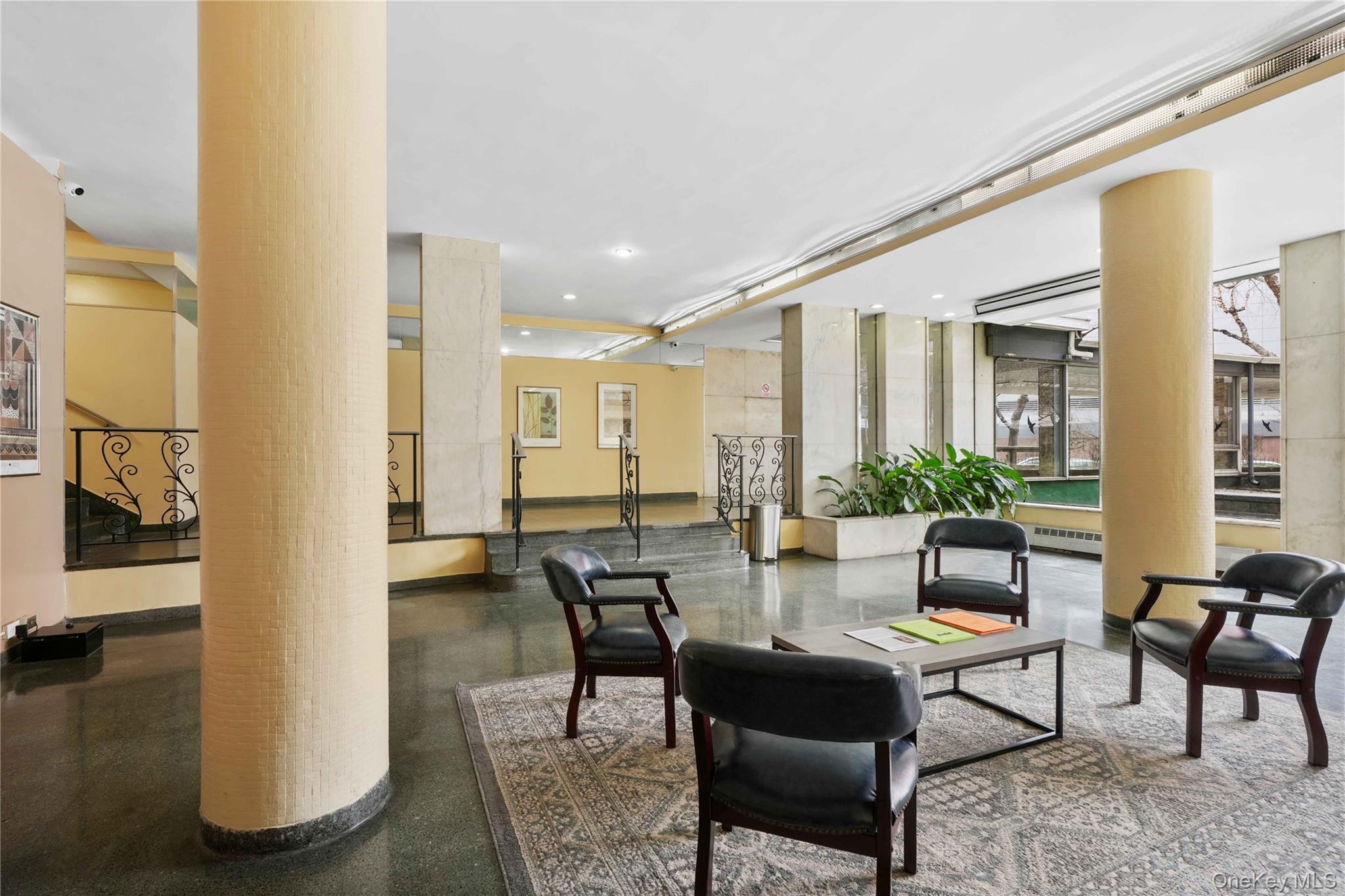 61-25 97th Street, Unit 15J Queens, NY 11374 - Photo 2 of 17 a living room with furniture and a table