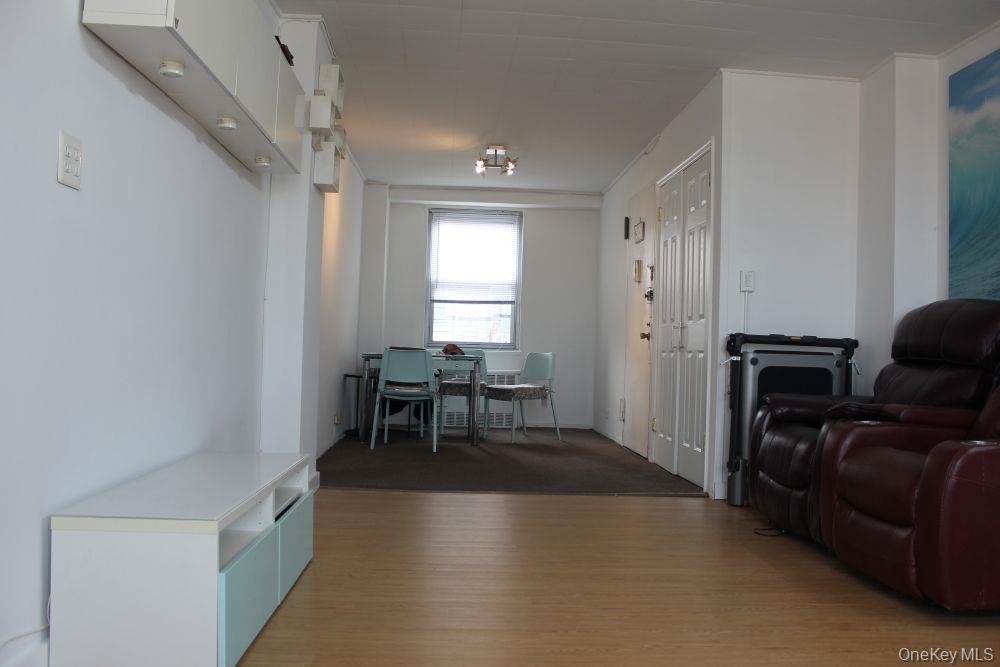 61-25 97th Street, Unit 15J Queens, NY 11374 - Photo 5 of 17 a view of a livingroom with furniture and windows