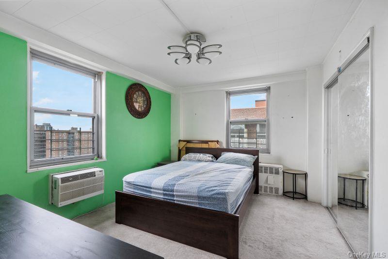 61-25 97th Street, Unit 15J Queens, NY 11374 - Photo 9 of 17 a bedroom with a bed and a window