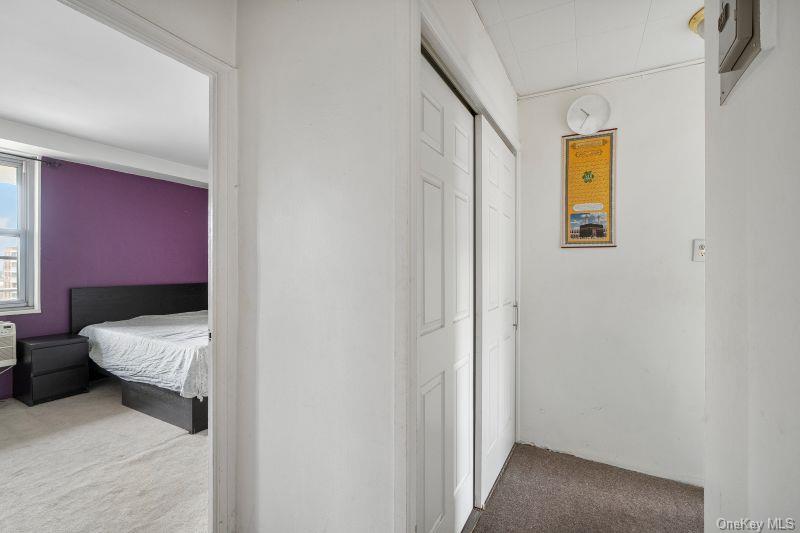 61-25 97th Street, Unit 15J Queens, NY 11374 - Photo 10 of 17 a bedroom with a bed and a window