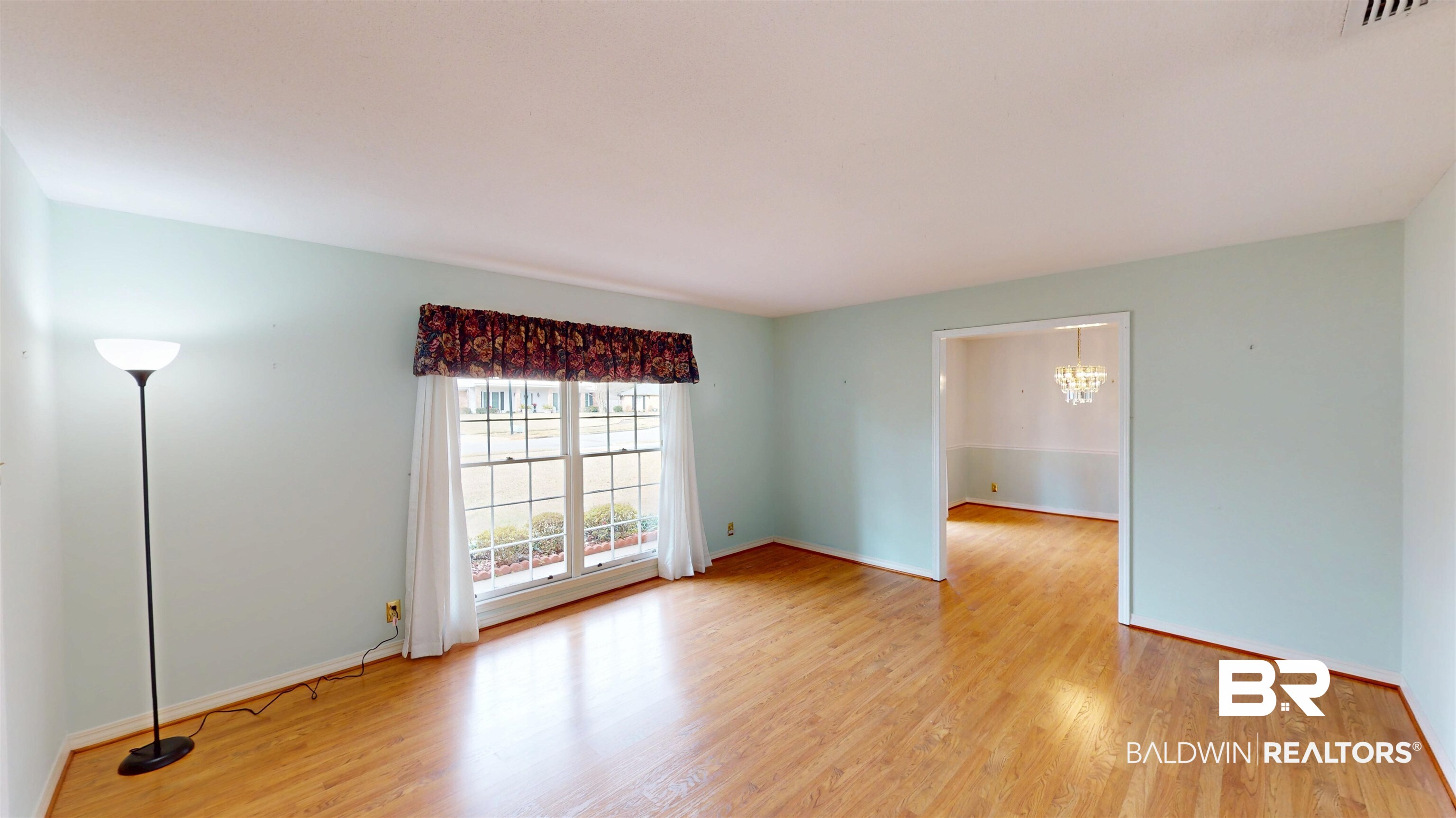 609 Burlington Court Mobile, AL 36608 - Photo 2 of 19 Spare room with a chandelier and light wood finished floors