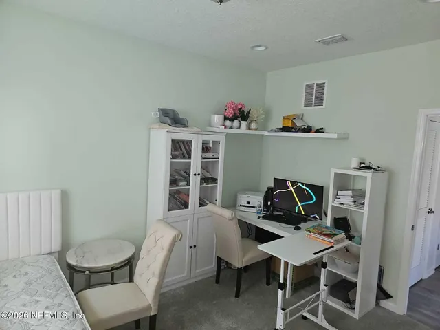 a view of a workspace with furniture