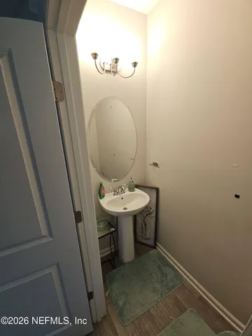 view of a bathroom with a sink and mirror