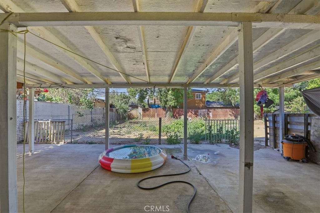 245 Commercial Avenue Riverside, CA 92507 - Photo 22 of 30 a backyard of a house with garden and outdoor seating