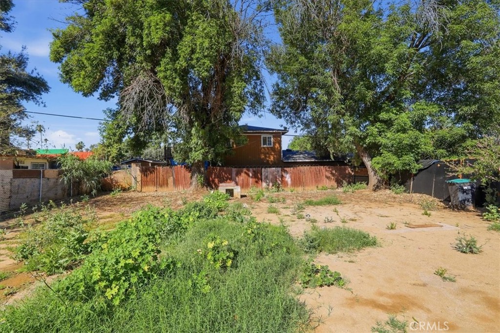 245 Commercial Avenue Riverside, CA 92507 - Photo 28 of 30 a view of a backyard with a garden and trees