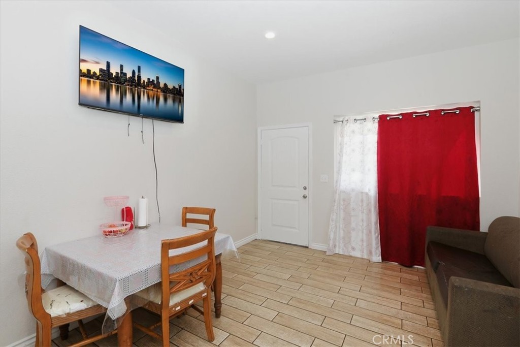 245 Commercial Avenue Riverside, CA 92507 - Photo 10 of 30 a workspace with furniture and wooden floor