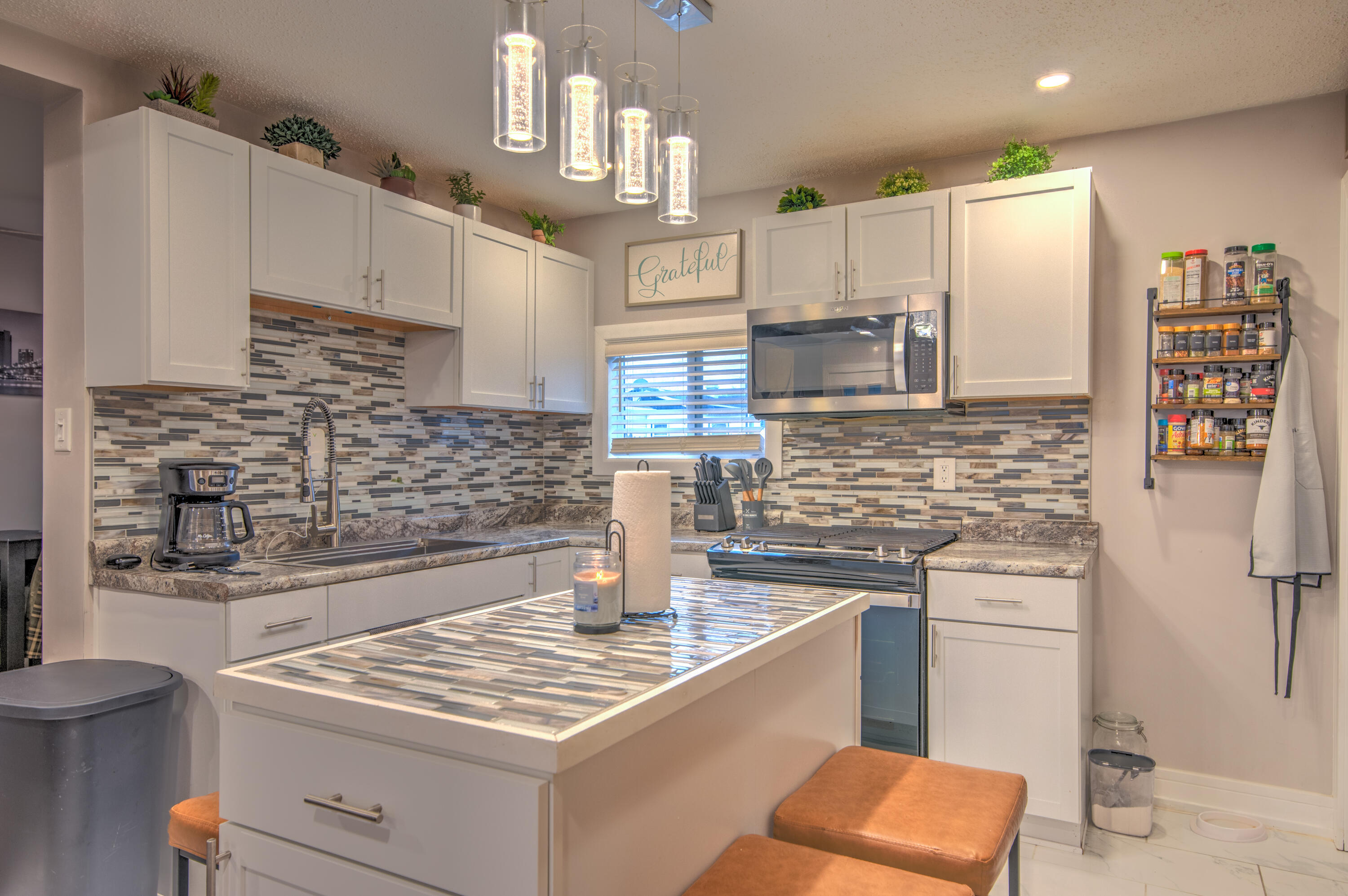 2080 Wright Street Gary, IN 46404 - Photo 7 of 20 a kitchen with stainless steel appliances granite countertop a sink stove and refrigerator