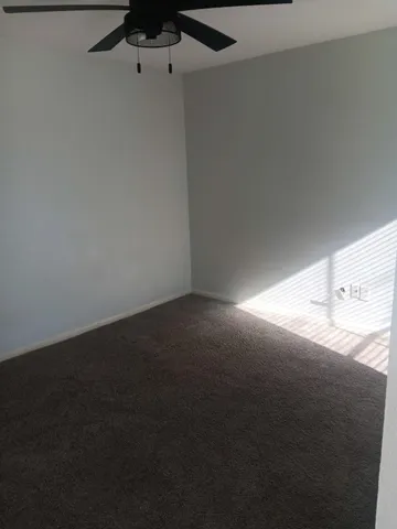 a white toilet sitting next to a white sink