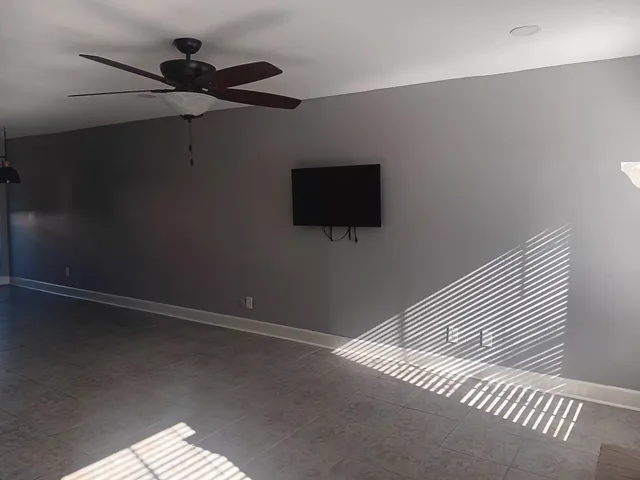 a view of a livingroom with a flat screen tv