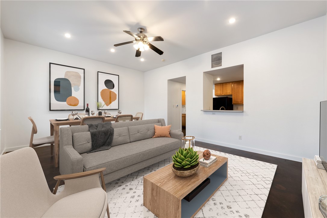2601 East 7th Street, Unit 201 Austin, TX 78702 - Photo 1 of 1 a living room with furniture and a flat screen tv