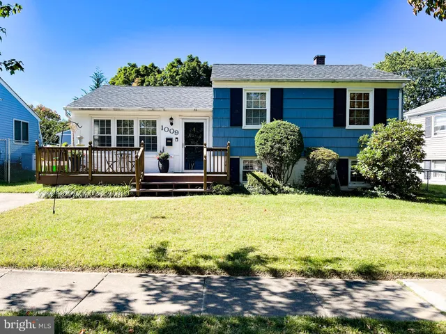 a front view of house with yard and outdoor seating