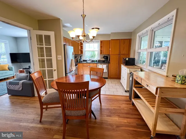 a kitchen with stainless steel appliances a refrigerator sink and microwave